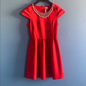 Red short sleeve dress with embellishments